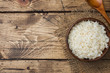 White boiled rice in a wooden bowl. Rustic style. Copy space