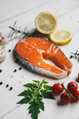 salmon steak fresh On white wood