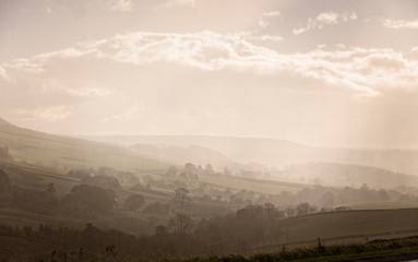 Wall Mural - Misty valley near Skipton, West Yorkshire, England, UK.