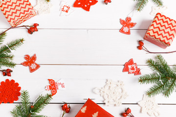 Christmas composition. Gifts, fir tree branches, red decorations on white background. Christmas, winter, new year concept. Flat lay, top view, copy space