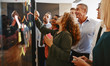 © Flamingo Images - Diverse businesspeople brainstorming together with sticky notes