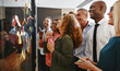 © Flamingo Images - Smiling businesspeople brainstorming with sticky notes on a glas