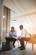 © Flamingo Images - Diverse businessmen discussing work together in an office