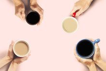 Many Hands Are Holding Cups Of Coffee On A Pink Background. Concept Breakfast With Friends, Friendly Company. Flat Lay, Top View
