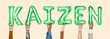 © Rawpixel.com - Hands holding Kaizen word in balloon letters