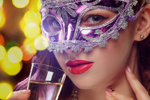 Beauty Model Woman Wearing Venetian Masquerade Carnival Mask At Party Over Holiday Dark Background With Magic Glow. Christmas And New Year Celebration. Glamour Lady With Perfect Make Up And Hairstyle