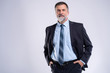 © opolja - Happy satisfied mature businessman looking at camera isolated on white background.