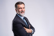 © opolja - Happy satisfied mature businessman looking at camera isolated on white background.
