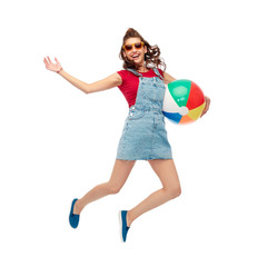 Wall Mural - leisure, summer holidays and people concept - smiling teenage girl in sunglasses with beach ball jumping over white background