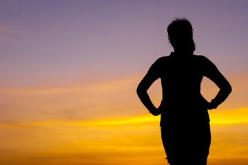 Wall Mural - Young woman relaxing with sunset