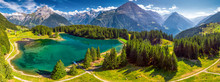Arnisee With Swiss Alps. Arnisee Is A Reservoir In The Canton Of Uri, Switzerland, Europe