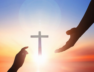 Wall Mural - jesus helping hand concept：world peace day help hand on sunset background