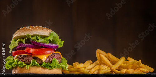 Fotografía Burger with French fries cutlet with cheese and tomato