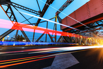 abstract image of blur motion of cars on the city road at night，Modern urban architecture in tianjing, China