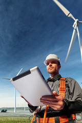 Wall Mural - happy engineer planning new project. he standing a top mount and looking in tablet . around beautifu