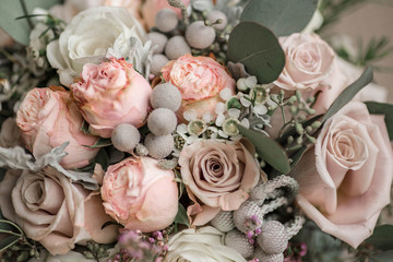 Wedding bouquet in shades of dusty rose, white, green, beige, pink and purple. Beautiful and delicate bridal bouquet.