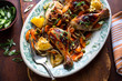 © Andrew Scrivani - Close up of roasted chicken with vegetable served on plate