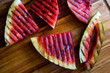 © Andrew Scrivani - Close up of grilled watermelon slices on wooden table
