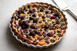 © Andrew Scrivani - Close up of berry clafouti against white background