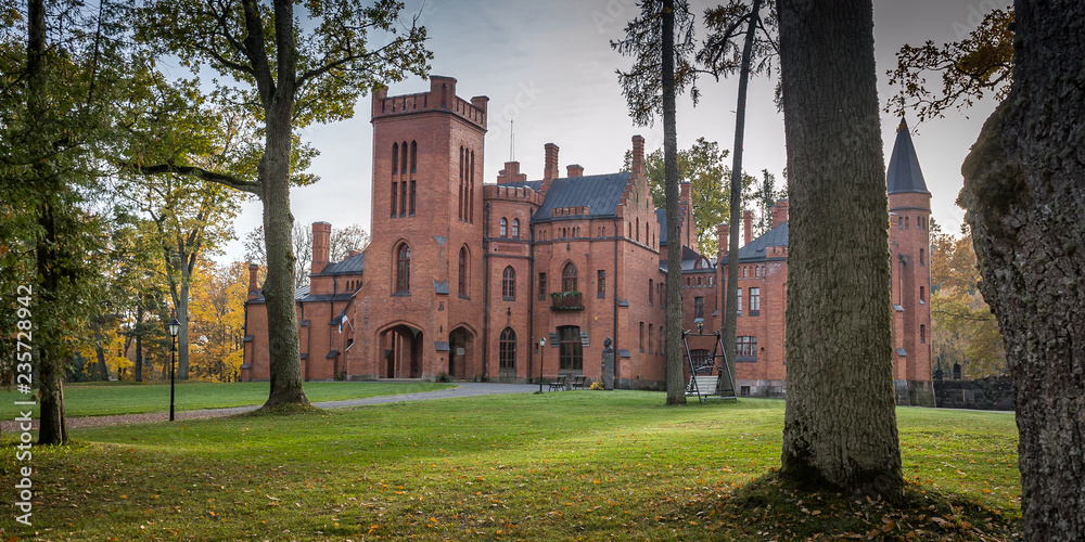 Old red brick manor house in the style of English castles. Sangaste ...