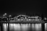 Fototapeta  - NIGHT CITY - An old stylish cruise ship by the river bank in Szczecin

