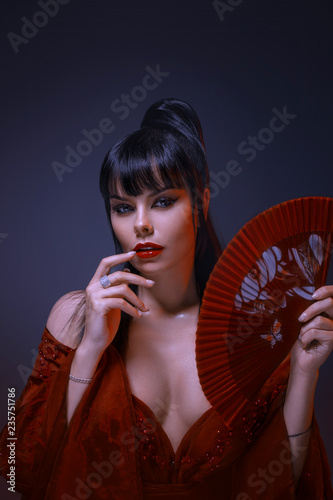Fotomural Attractive young sexy girl with black hair, gray eyes and amazing makeup