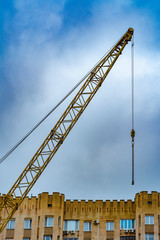 Wall Mural - Upper part of the construction crane above the building