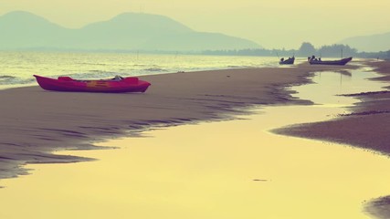 Wall Mural - Kayak on beach in warm atmospher of sea and sky