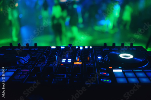 Fotografie, Obraz DJ mixer controller panel for electronic music in night club