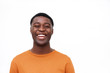 © mimagephotos - Close up laughing african american man against isolated white background
