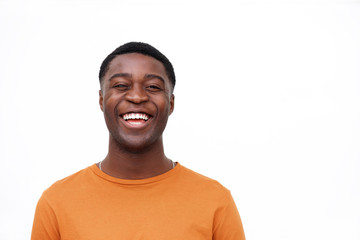 Close up laughing african american man against isolated white background