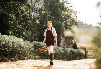 Happy woman walking at her farm