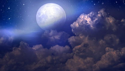 Wall Mural - The full moon between the clouds in the night sky