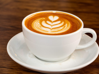 Wall Mural - White coffee cup on wood table, coffee time