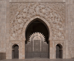 The Hassan II Mosque in Casablanca, Morocco. Ornate exterior brass door. Hassan II Mosque is the largest mosque in Morocco and one of the most beautiful. the 13th largest in the world.