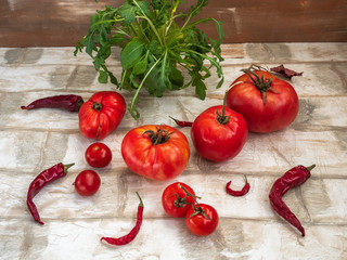 Vegetable set of red tomatoes, fresh arugula, hot pepper