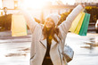 © Drobot Dean - Cheerful young woman dressed in autumn coat and hat