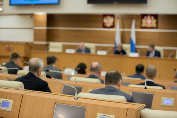 Conference room or seminar meeting room in business event. Session of Government. Academic classroom training course in lecture hall. blur abstract background. working in modern bright office indoor