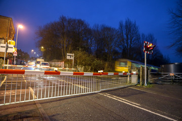 Wall Mural - Barriers down at the level crossing