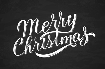 Wall Mural - Merry Christmas calligraphy lettering on chalkboard. Hand drawn holidays celebrations quote. Chalk lettering vector illustration.  Easy to edit vector template