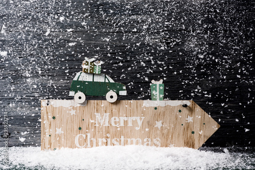 Fotografia, Obraz text merry christmas in a wooden signboard