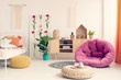 © Photographee.eu - Stylish teenage girl bedroom with comfortable bed, macrame on the wall, flower board, wooden cabinet and pink pouf