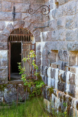 Canvas Print - Iron gate at a defense plant at an old fortress