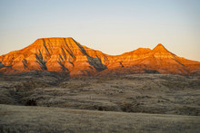 Alpenglow On Badlands Mountain Cliffs In Eastern Montana During Sunrise, Near Miles City, MT