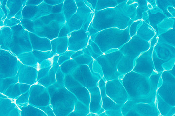  Water ripples and pattern on swimming pool surface with sunlight reflection