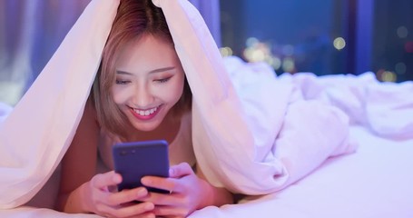 Sticker - woman use phone on bed