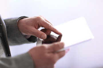 Wall Mural - close up.businessman presses on the screen of a digital tablet.p