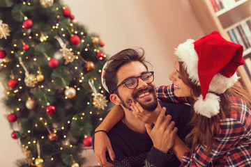 Wall Mural - Couple's Christmas morning fun