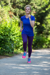 young female runner training for marathon