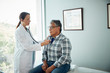 © Gregory Miller - Doctor examining man